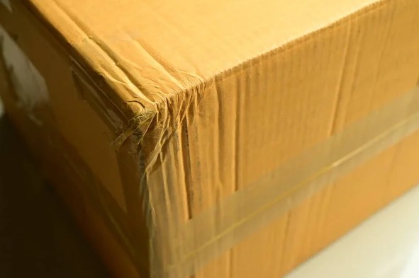 depositphotos_616938682-stock-photo-brown-box-packaging-shipping-paper~2.jpg