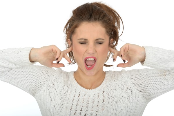 woman_with_fingers_in_ears.jpg