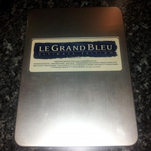 Le Grand Bleu Japanese Ultimate Edition DVD
Tin about the size of an iPad. contains Director's Cut with DTS 5.1 Widescreen and European Theatrical Cut DD 2.0 Fullscreen. also contains blue see through folder with lobby cards, posters