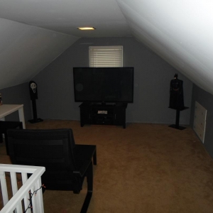 My attic "mancave"..just a place to chill and get some work done, or watch a movie..60" tv and ikea poang chair up here,is all I need,LOL!!..Will post pics of my home theater later!!