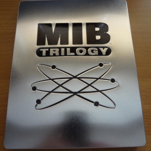 Men In Black Trilogy  Play.com Exclusive Embossed Steelbook Front