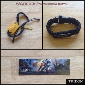 CLOCKWISE, LEFT TO RIGHT (all promotional items in Asia): Kaiju Bracelet, Survival Utility Bracelet, Bookmark