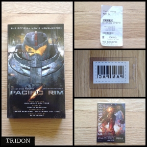 CLOCKWISE, LEFT TO RIGHT: Pacific Rim Official Movie Novelization, original Cineplex Superticket from my opening night viewing of Pacific Rim, a PanPac decal and an unopened package of Pacific Rim trading cards from Asia.