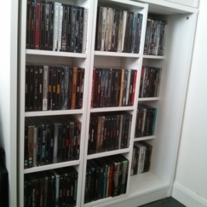 224 Steelbooks front and behind, some DVDs on top shelf behind
