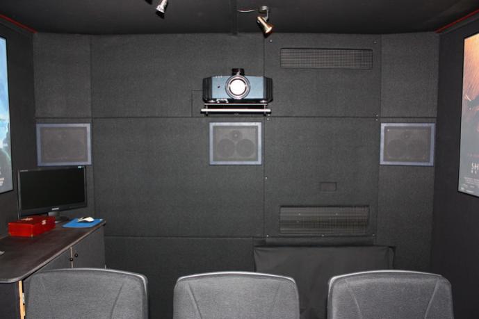 Back wall with 3 more Canton LCR 500 in-wall speakers, a JVC - X3 projector and hidden air-con. in the wall.