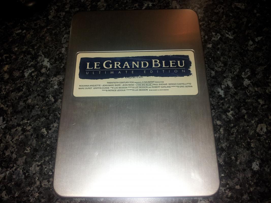 Le Grand Bleu Japanese Ultimate Edition DVD
Tin about the size of an iPad. contains Director's Cut with DTS 5.1 Widescreen and European Theatrical Cut DD 2.0 Fullscreen. also contains blue see through folder with lobby cards, posters